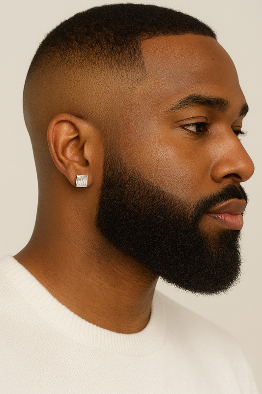 Man with a well-groomed beard and short hair on a plain background