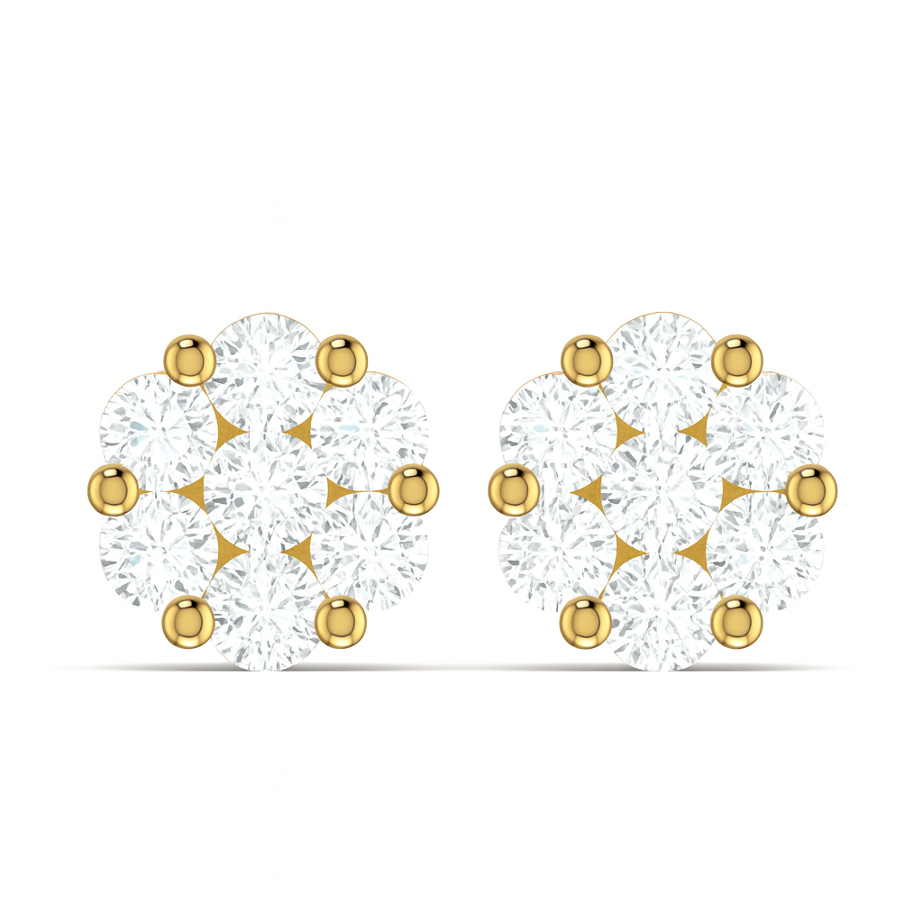 Gold and clear gemstone earrings on a white background