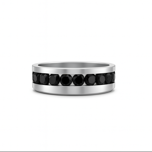 Silver ring with black gemstones on a white background