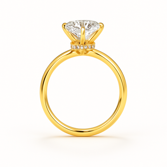 Gold ring with a diamond on a white background