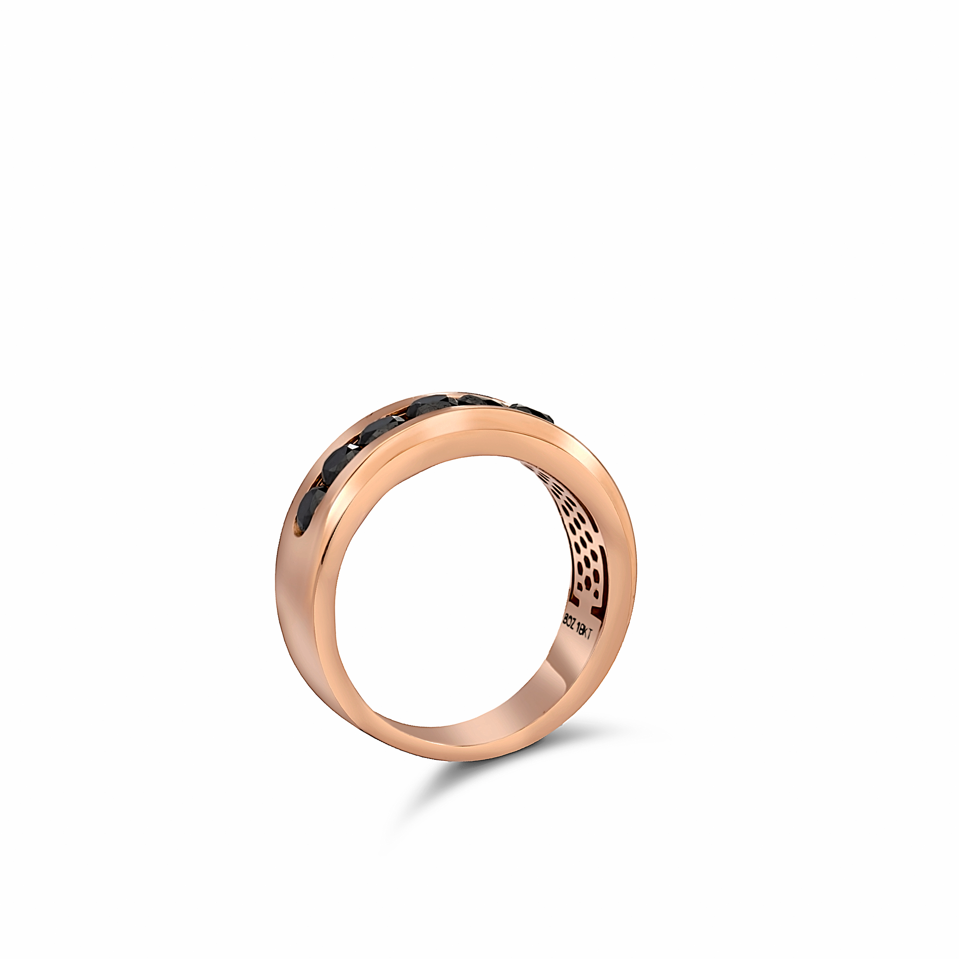 Rose gold ring with black gemstone on a white background