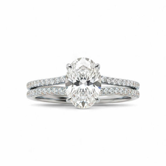 Simi Oval Cut CZ bride set in 925 sterling silver with radiant cubic zirconia centerpiece and matching wedding band