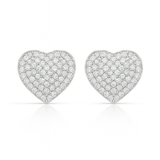 Heart-shaped diamond earrings on a white background