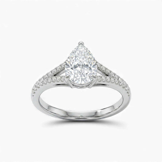 Diamond ring with a pear-shaped center stone on a white background