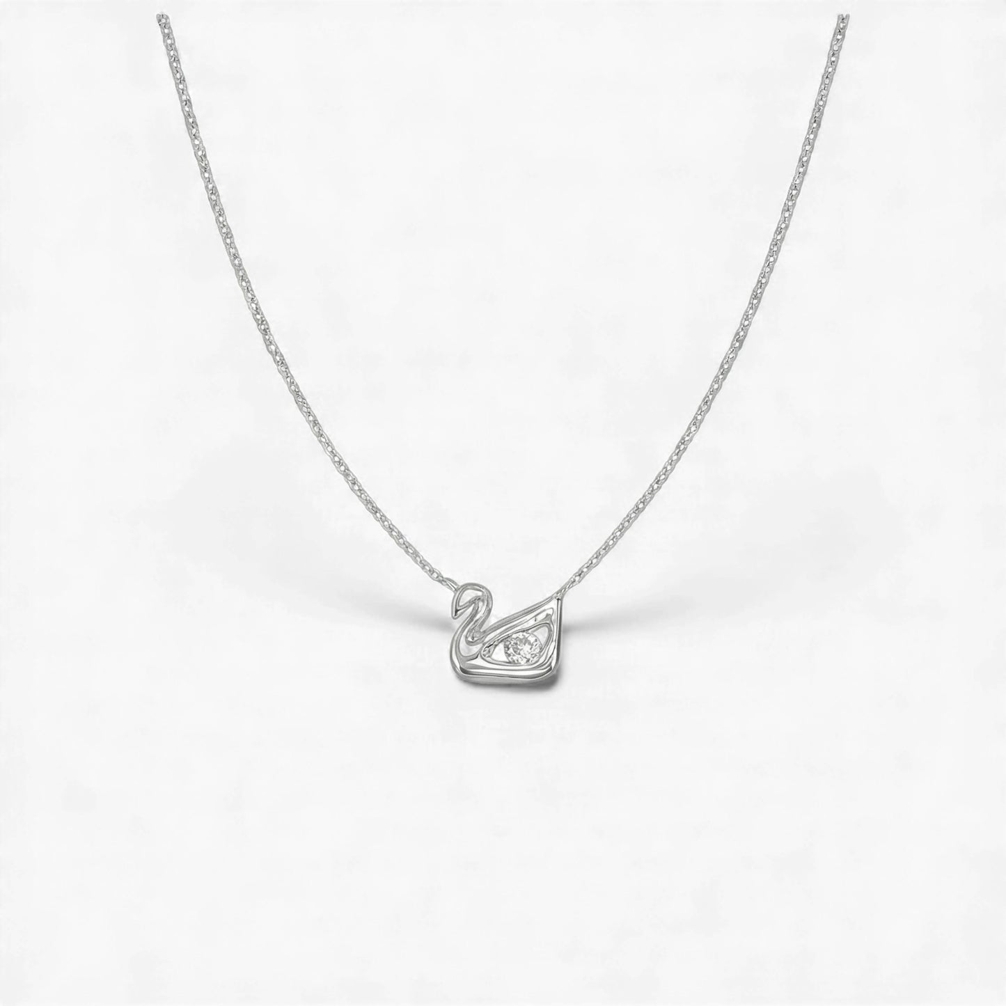 Silver swan pendant necklace on a white background