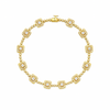 Gold bracelet with diamond accents on a white background