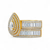 Gold ring with diamond accents on a white background