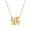 Gold necklace with a diamond-encrusted clover pendant on a white background
