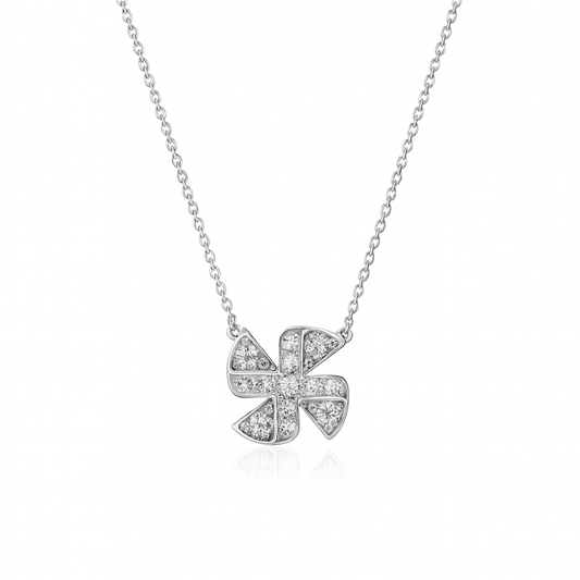 Silver necklace with a diamond-encrusted clover pendant on a white background