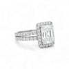 Diamond ring with a rectangular stone on a white background