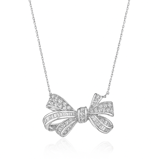 Silver bow-shaped pendant necklace on a white background
