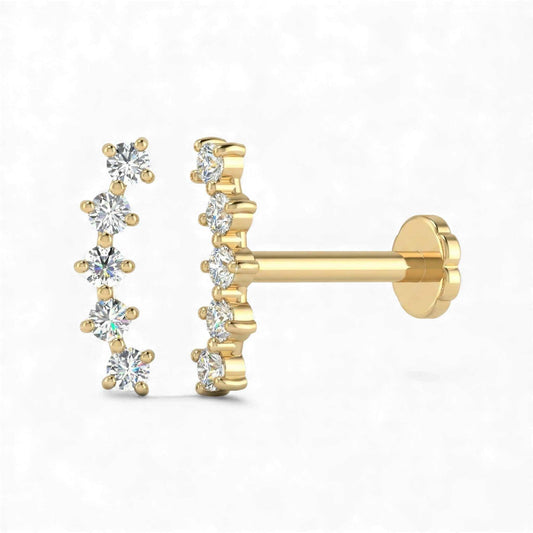 Gold earrings with diamond-like stones on a white background