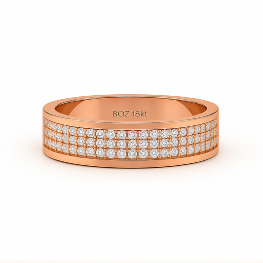 Rose gold ring with diamond accents on a white background