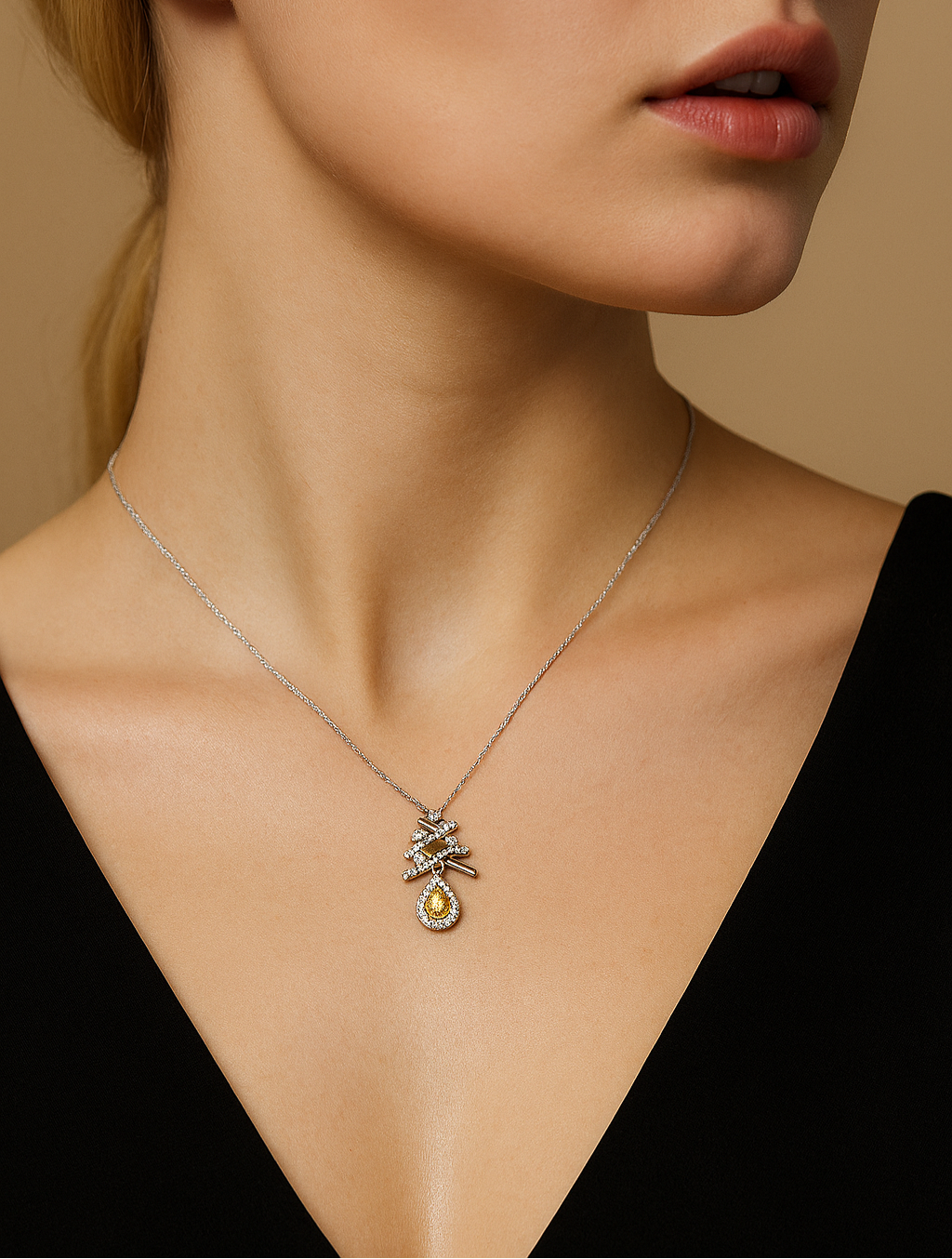 Close-up of a woman wearing a necklace with a pendant against a neutral background
