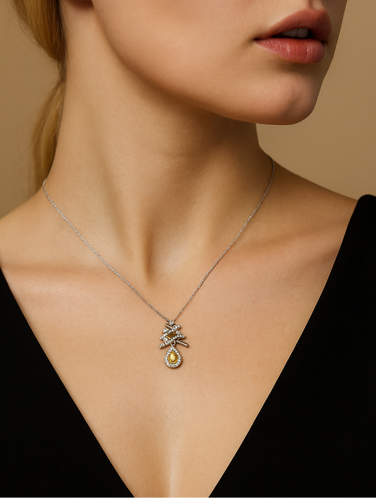 Close-up of a woman wearing a necklace with a pendant against a neutral background